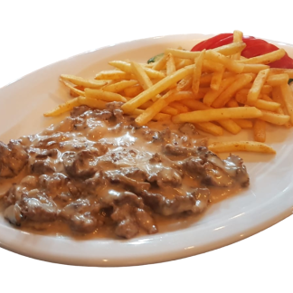Strips of fillet in mushroom cream sauce with pasta